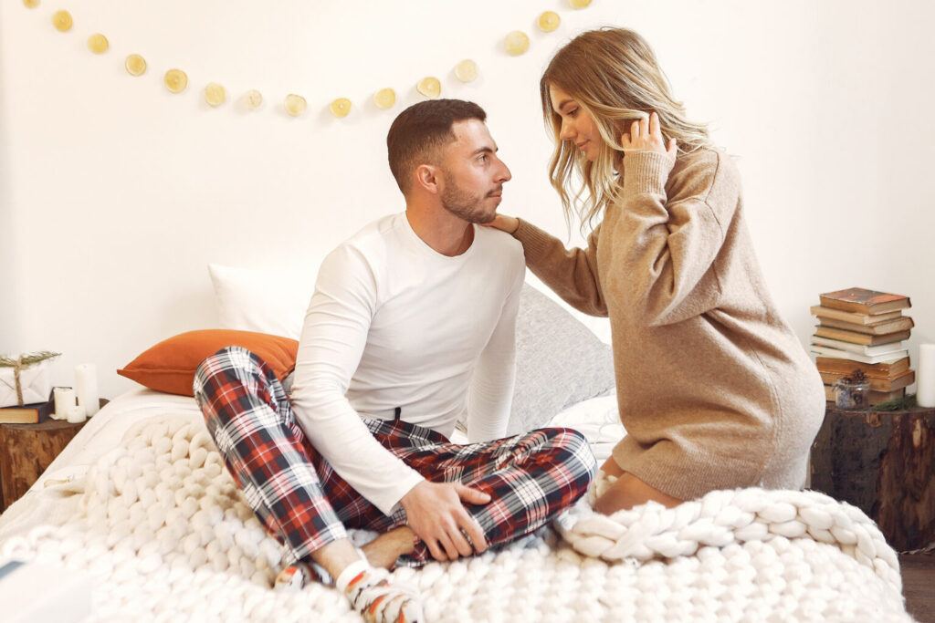 couple sitting bed room 1536x1024 1